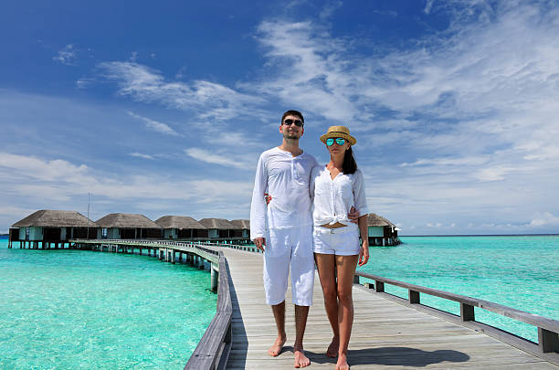 istock Couple on a beach jetty at Maldives 188064512