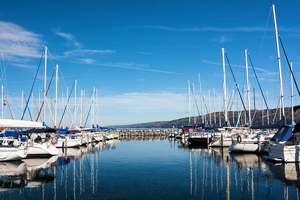 Marina Lots of sails boats at the boat marina harbor at the southern end of Seneca lake in Watkins Glen New York on a beautiful blue sky day in autumn. lake seneca stock pictures, royalty-free photos & images