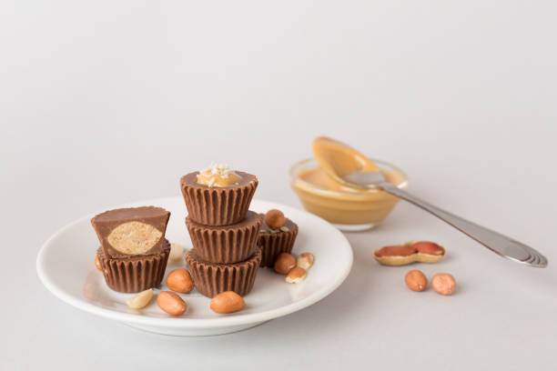 istock Tasty chocolate peanut butter cups on color background 1880665408
