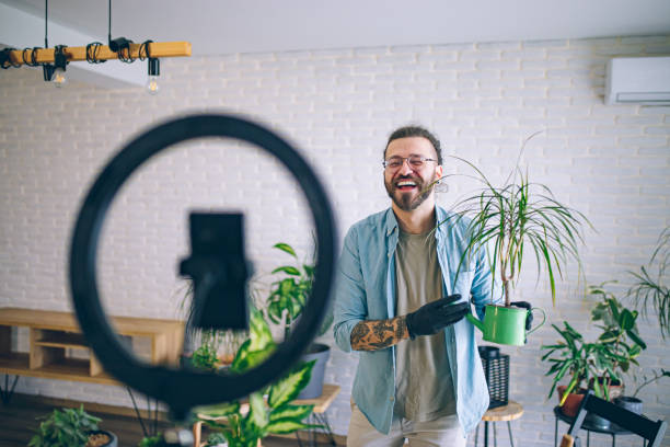 istock Vlogger making a video on diy gardening tips 1880665411