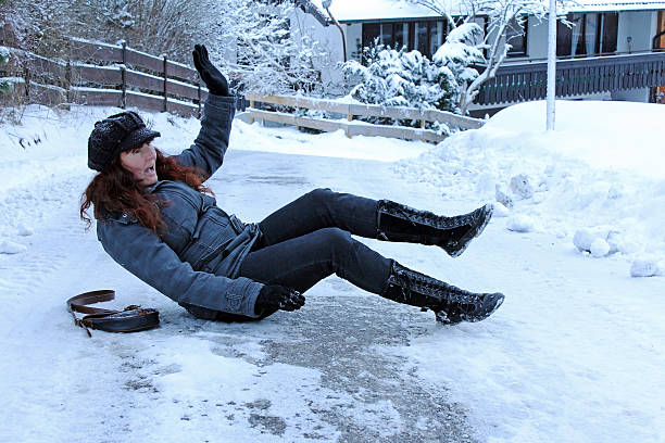 istock A woman has fallen on an icy street 188067885