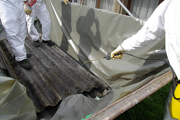 istock Suited people applying asbestos chemicals 188069330