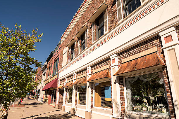Small Town Main Street A photo of a typical small town main street in the United States of America. Features old brick buildings with specialty shops and restaurants. rural main street stock pictures, royalty-free photos & images