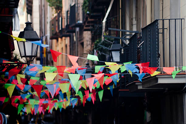Feast decorations hanging in a narrow street in Barcelona (Catalunya, Spain) 