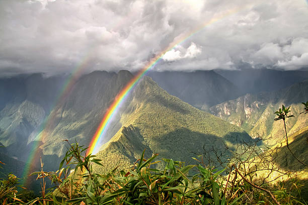 Rainbows in the mountains of Machu Picchu, Cusco, Peru stock photo