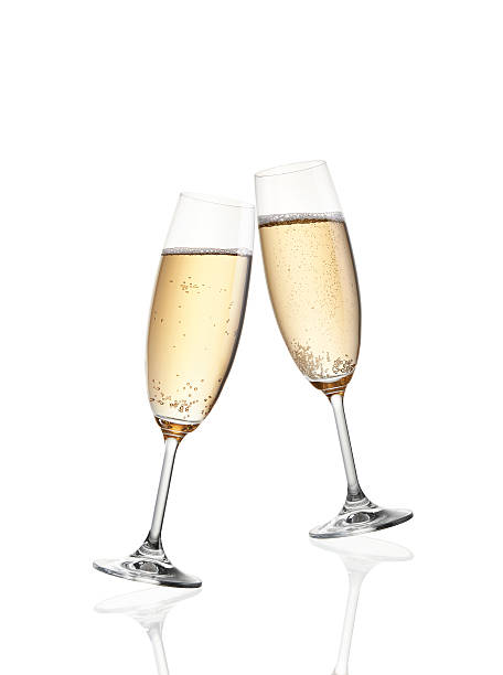 Celebration toast with champagne Glass of champagne isolated on white background champagne flute stock pictures, royalty-free photos & images