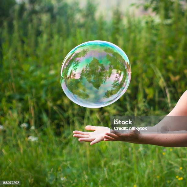 Hand Catching A Soap Bubble Stock Photo - Download Image Now - Soap Sud, Catching, Backgrounds