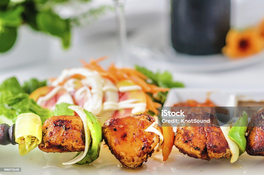 Chicken BBQ & decaration BBQ chicken on a white plate on a table with red wine Table decoration. Asia Stock Photo