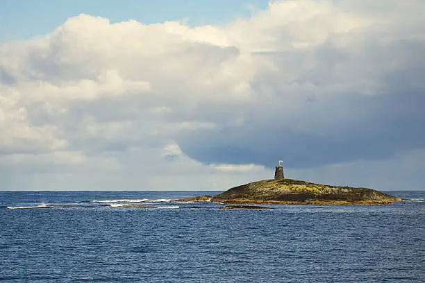 Photo of lighthouse on the rock