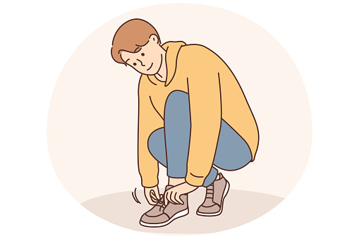 A little boy ties a shoelace on his shoe. Childrens clothing for walking, training in tying shoes, tightening laces and tying knots, preparing childrens shoes vector illustration
