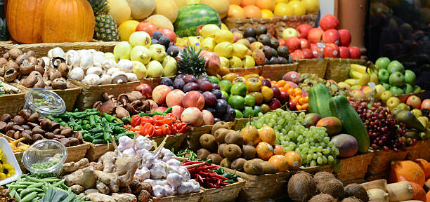 istock Fruit market with various colorful fresh fruits and vegetables - 188073043