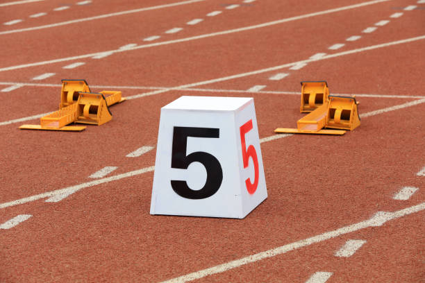 istock Track numbers and starters on the plastic track on the playground 1880748937