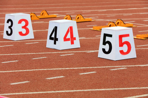 istock Track numbers and starters on the plastic track on the playground 1880749445
