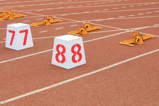 istock Track numbers and starters on the plastic track on the playground 1880749951