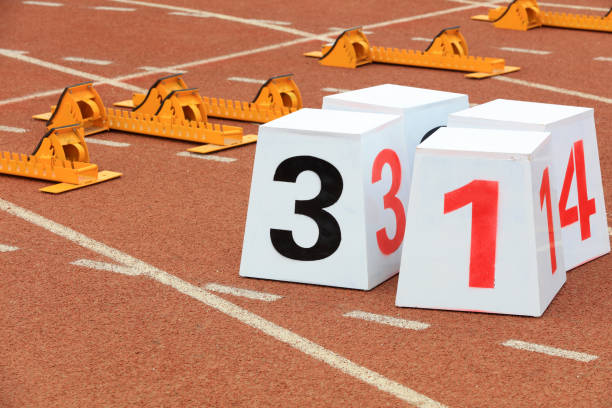 istock Track numbers and starters on the plastic track on the playground 1880749959