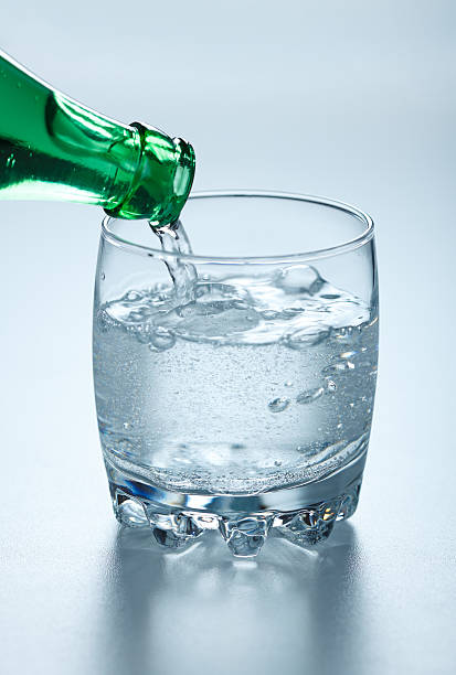 istock Mineral water pouring into glass 188079736
