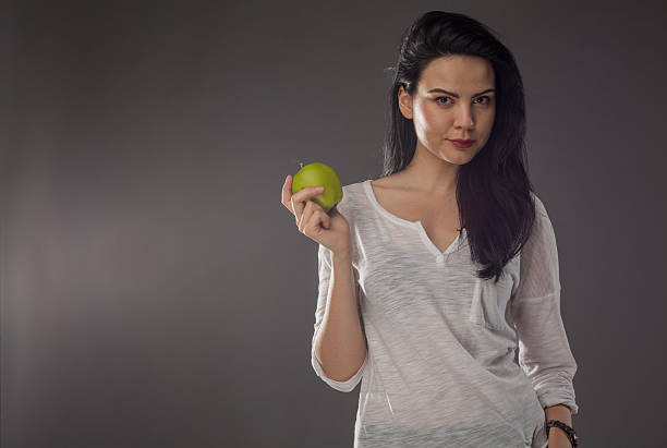 istock Fit girl holding apple 188079827