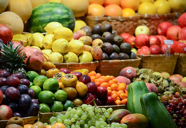 istock Fruit market with various colorful fresh fruits and vegetables - 188079968