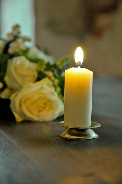 istock Wedding bouquet and burning candle 188080260