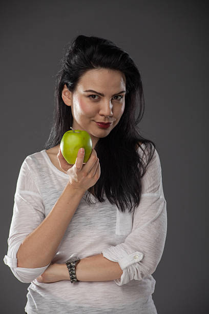 istock Fit girl holding apple 188080397