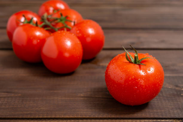 Free Stock Photo of Five ripe red tomatoes on a light wooden surface ...