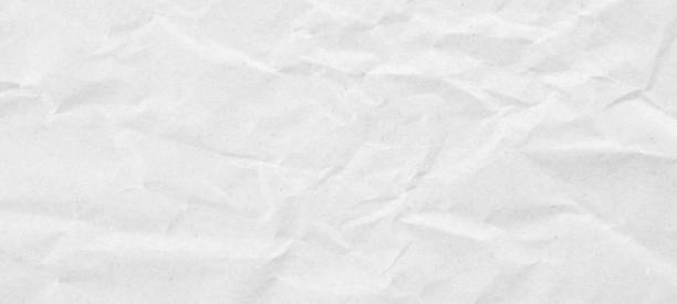 istock Abstract white crumpled and creased recycle paper texture background 1880829545