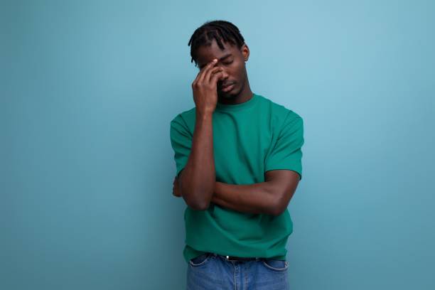 istock tired american young man with dreadlocks 1880831138