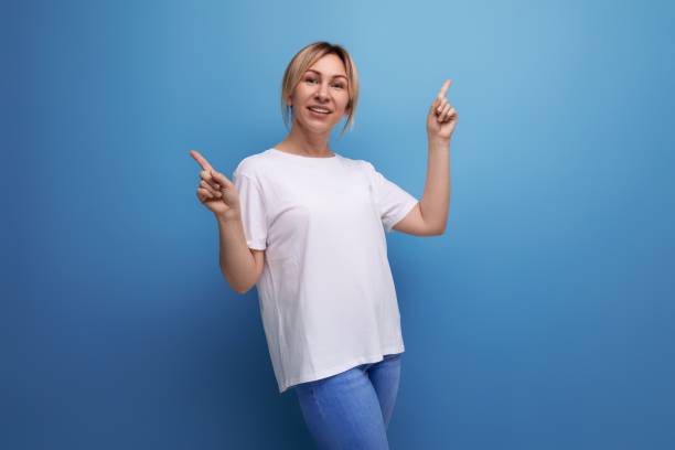 istock blond thin woman is dressed in a white T-shirt for printing information on it 1880842433