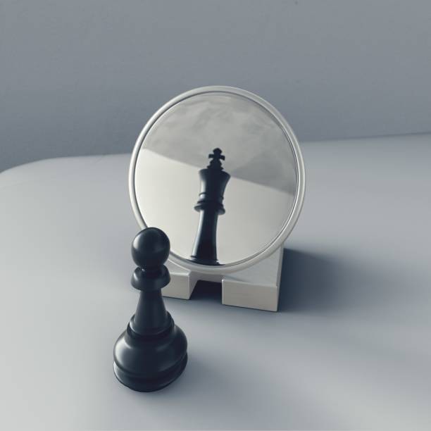 istock Pawn looking in the mirror and seeing a king 1880869685