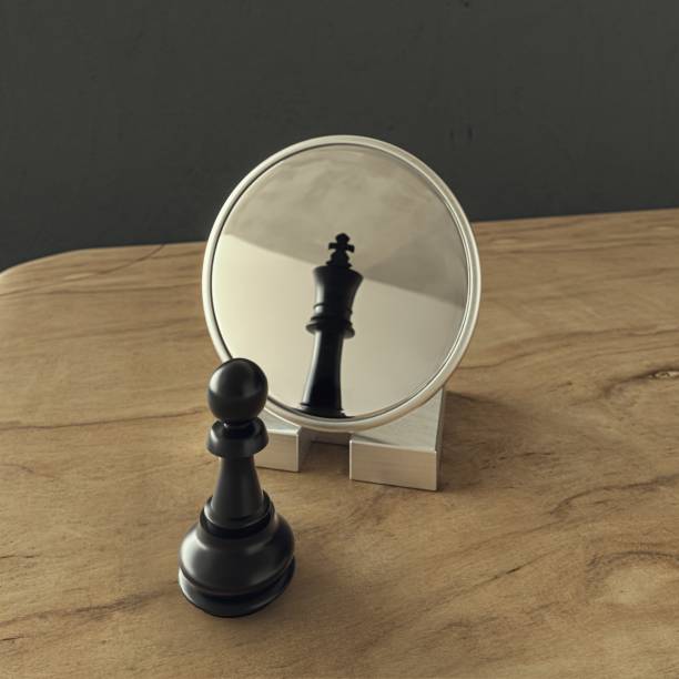 istock Pawn looking in the mirror and seeing a king 1880869688
