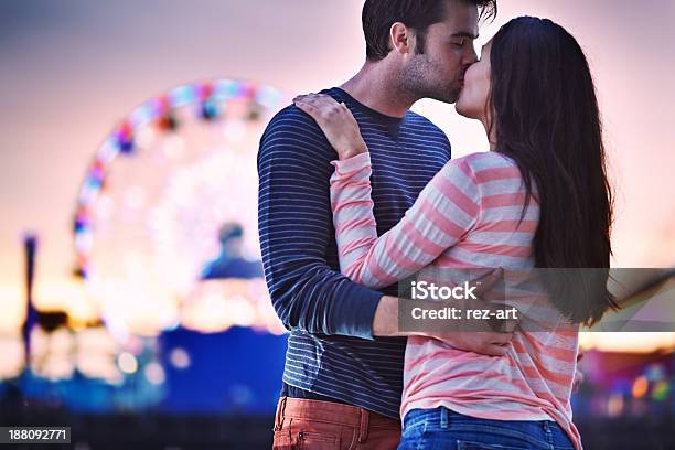 Young Couple Kissing Near Santa Monica Pier Stock Photo - Download Image Now - Adult, Adults Only, Affectionate
