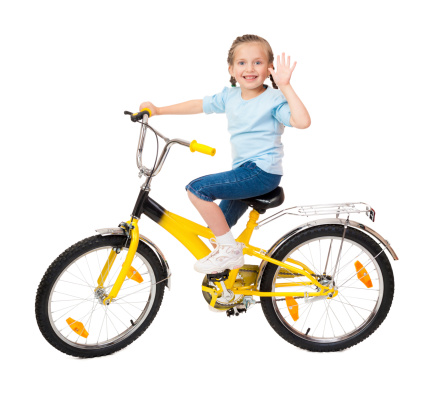 girl on bicycle isolated on white