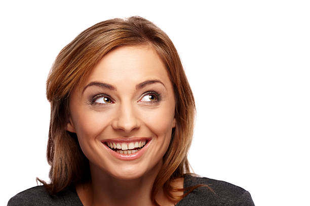 istock Cheerful young woman looking at corner 188092898