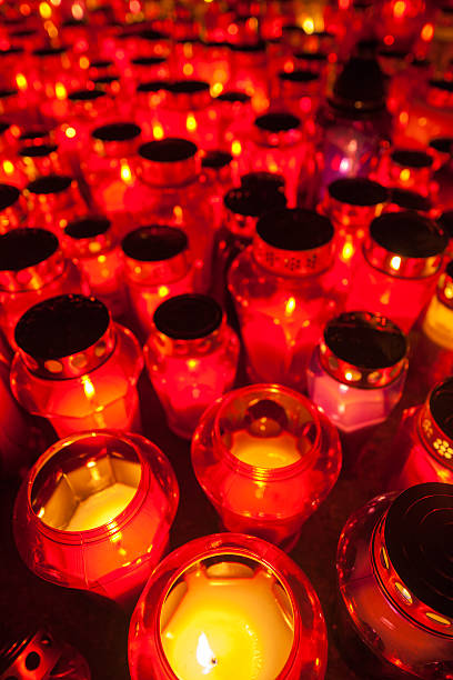 istock Candle flames illuminating a cemetery 188093502