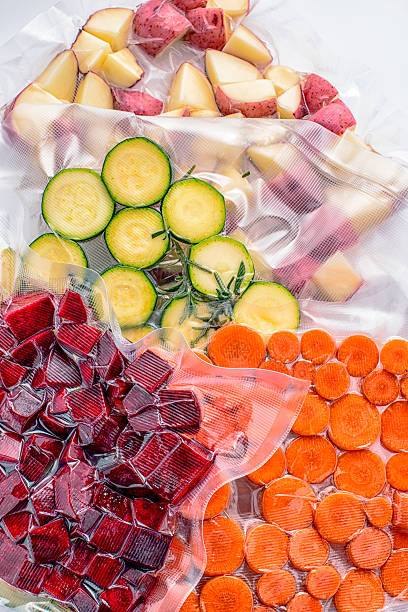 Sous vide cooking: Vegetables Vacuum packed vegetables, ready for sous vide cooking in a water oven under low temperatures for long periods of time. vacuum packed stock pictures, royalty-free photos & images