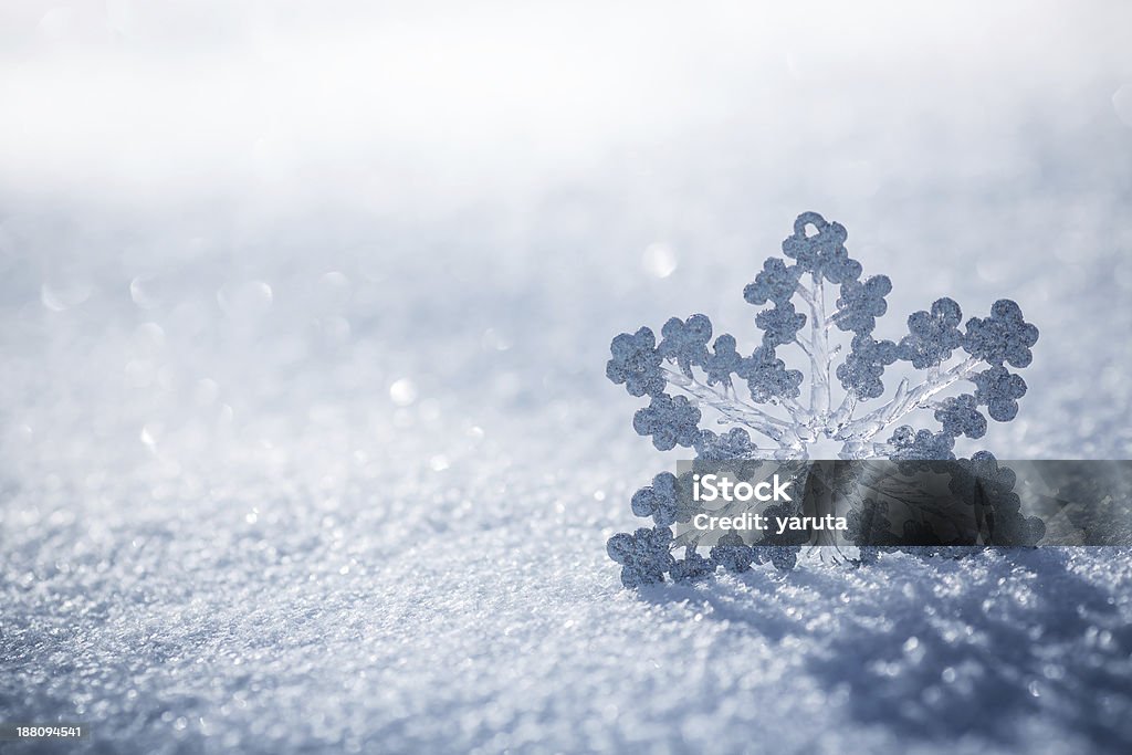 Silver Christmas decoration on snow Silver Christmas decoration. Beautiful snowflake on real snow outdoors. Winter holidays concept Beauty Stock Photo