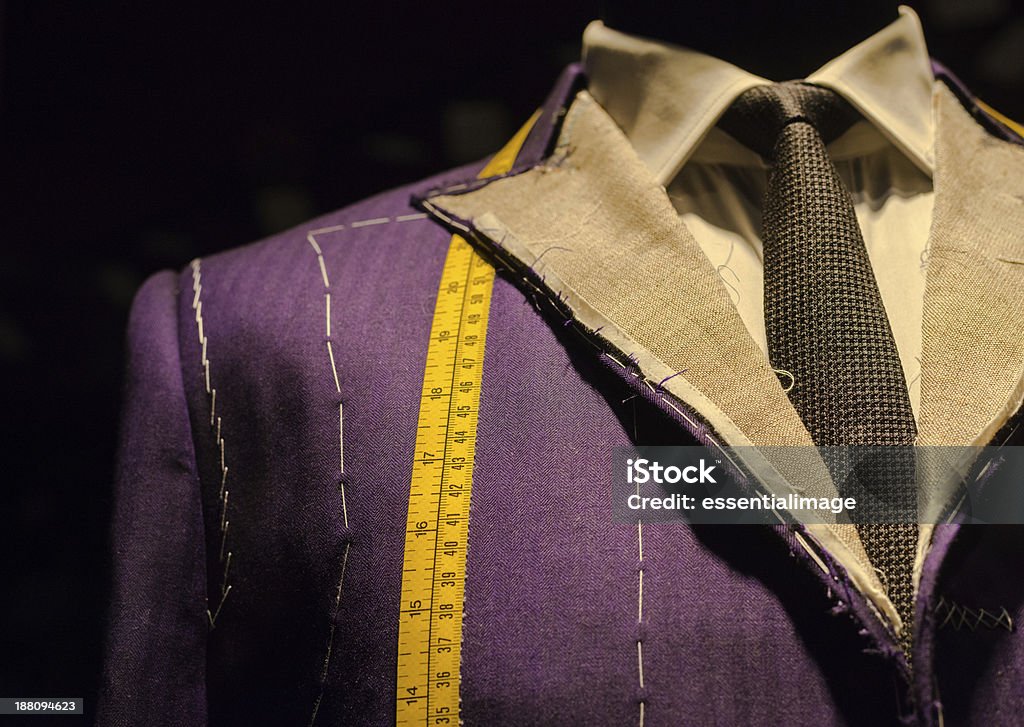 Suit on Tailor's Dummy Work in Progress Suit on Mannequin with Yellow Tape Measure Suit Stock Photo
