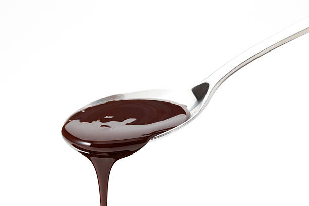 schokoladen-sirup - chocolate chocolate candy dark chocolate pouring stock-fotos und bilder