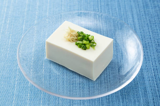 istock Tofu on a blue background. 1881096915
