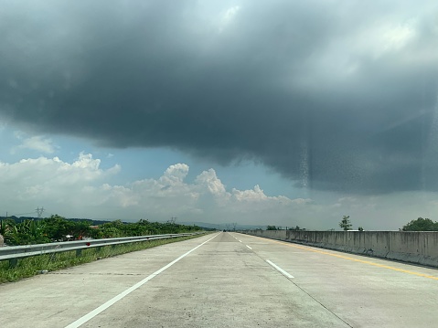 Highway view with cloudy sky