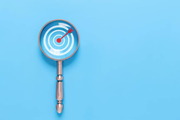 istock magnifying glass shows the target icon. concept of manager vision performance to 1881115331