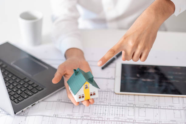 istock real estate agent or architect explains the housing project to his client online 1881117914