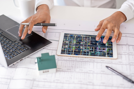 real estate agent or architect explains the housing project to his client online