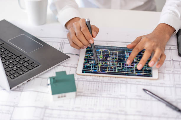 istock real estate agent or architect explains the housing project to his client online 1881117924