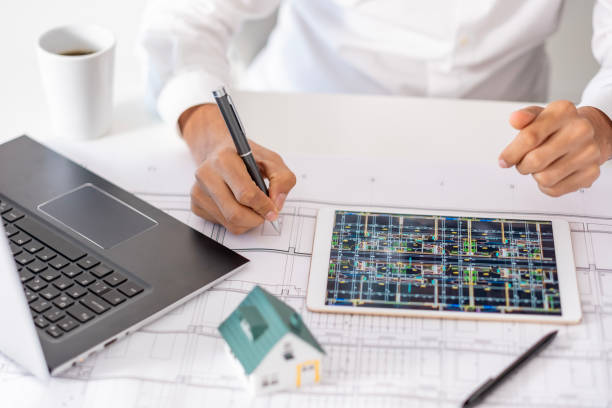 istock real estate agent or architect explains the housing project to his client online 1881117925