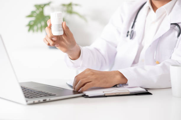 istock Doctor doing online examination puts medical medication 1881119481