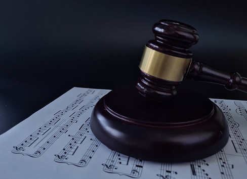 Rights of performers and composers and court infringement of musical copyright concept