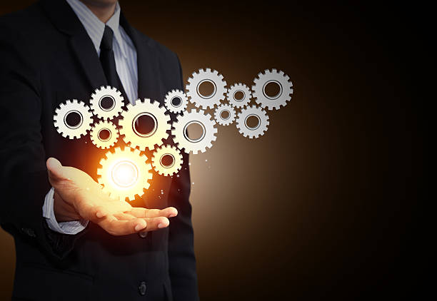 istock Business man hand show gear to teamwork as concept 188116692
