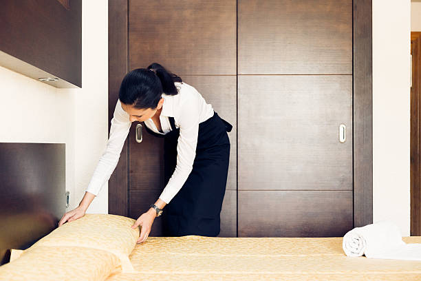 istock maid making a hotel room 188117175