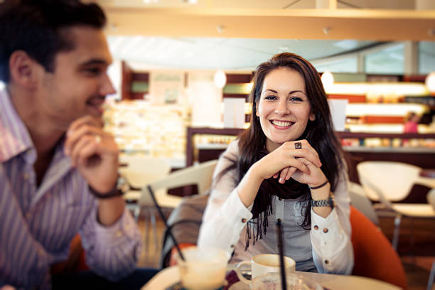 istock young couple having coffee in a cafe 188117320